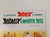 the book asterix and the white iris is on a white surface