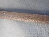 a metal object that is on a mesh surface