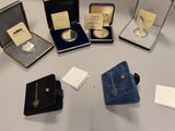 several different types of jewelry are displayed on a table