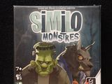 a box with a picture of a monster and a cat on it