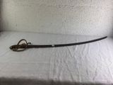 a sword that is laying on a bed with a white sheet