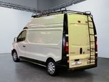 a white van with a ladder on the back of it
