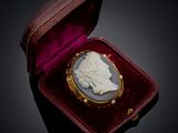 an image of a cameo of a woman in a red case