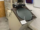 a machine that is sitting in a room with a whiteboard
