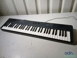 a keyboard that is sitting on a table in front of a radiator