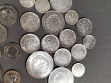 a lot of coins that are on the table