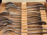 a lot of forks that are in a box