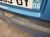 a close up of a car ' s license plate on the back of it