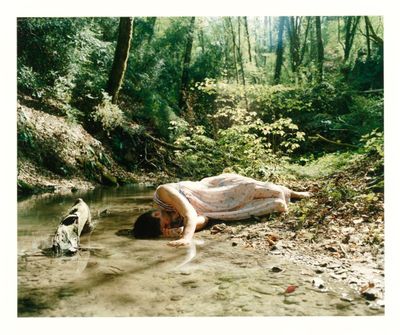 a woman that is laying down in the water