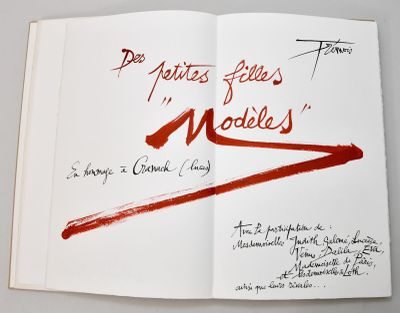 a book with a red marker on it that has writing on it