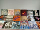 many different types of vinyl records on a table