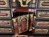 a cabinet that has a clock on top of it