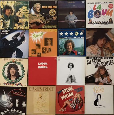 many different album covers on the wall of this room