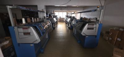 many machines that are lined up in a room