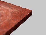 a close up view of a wooden table with a metal base