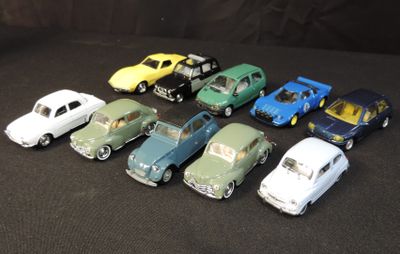 several toy cars are lined up in a row on a black surface