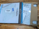 a box of mail sitting on a wooden table