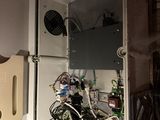 many wires and wires in the open door of a refrigerator