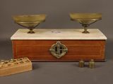 a wooden box with two bowls on top of it