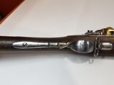 an old gun that is sitting on a table