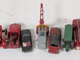several toy cars are lined up in a row on a white surface