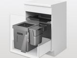 une armoire blanche avec deux poubelles et une poubelle à l'intérieur