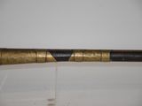 a close up of a baseball bat sitting on top of a table
