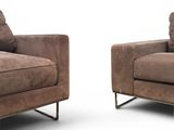 pair of brown leather chairs on a white background with a white background