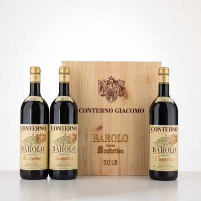 three bottles of wine in front of a wooden box