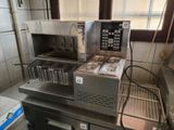 an image of a commercial kitchen with a lot of food in it