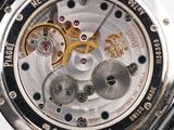 a close up of a watch with a black leather strap