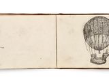 an open book with a drawing of a hot air balloon on it