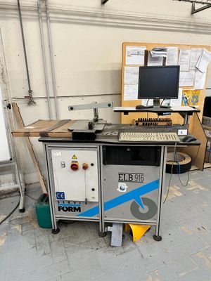 a computer desk with a keyboard and a monitor on it