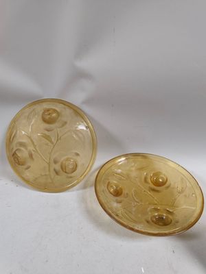 pair of yellow glass buttons with flowers and leaves on them