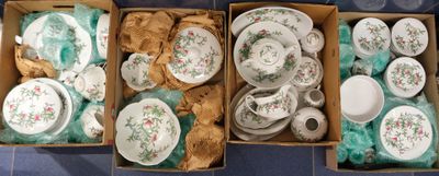 two boxes of tea cups and saucers on the floor