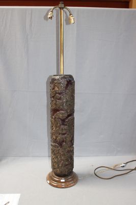 a lamp that is sitting on a table next to a lamp