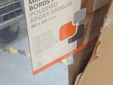 a cardboard box that has a mirror in it