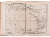 an open book with a map of the world on it