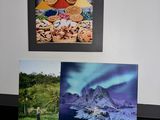 two pictures of a mountain and a lake on the wall