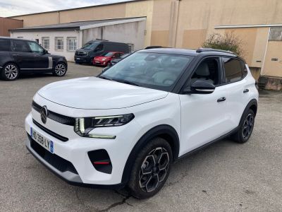 a white suv parked in a parking lot next to other cars