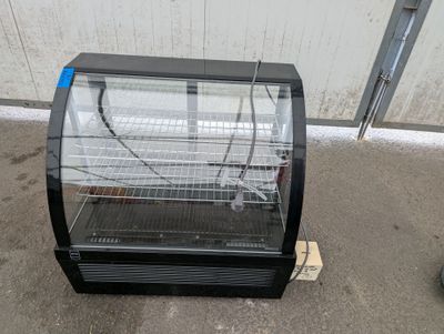 an image of a refrigerated refrigerator in a garage