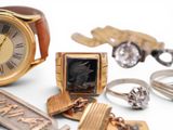 many different types of jewelry including a watch, ring, and keychain