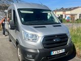 the grey van is parked on the side of the road