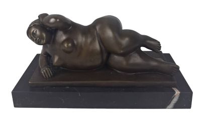 bronze sculpture of a woman laying on a marble base
