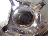 a close up view of a silver teapot on a table