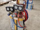 a picture of a propanent with a hose attached to it