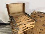 a suitcase that has a bunch of clothes in it