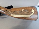 a wooden rifle with a wooden handle on a table