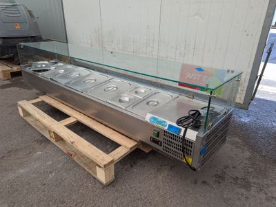 an image of a buffet table with a glass top on a pallet