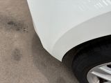 a close up of a car ' s tire on the ground